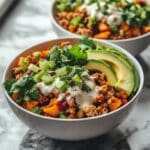 Sweet Potato Turkey Taco Bowls: Flavor-Packed & Family-Friendly sweet potato turkey taco bowls Sweet potato turkey taco bowls topped with avocado, cilantro, and creamy yogurt in white bowls
