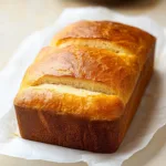 Gluten-Free Japanese Milk Bread (Tangzhong) – Soft, Pillowy, and Easy Gluten-Free Japanese Milk Bread Whole loaf of golden-brown gluten-free Japanese milk bread resting on parchment