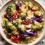 roasted vegetable quinoa bowl with broccoli and feta cheese