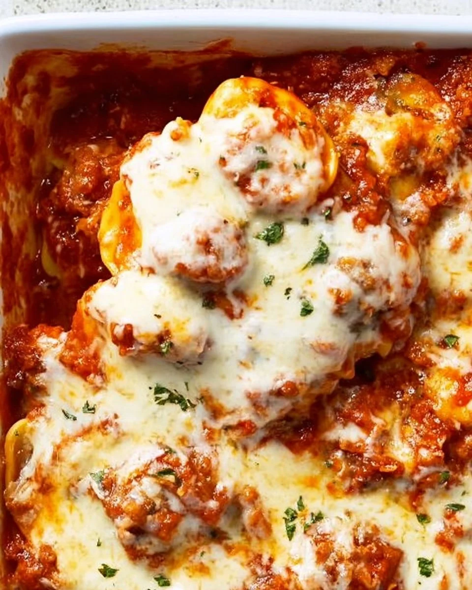 Ravioli Lasagna Bake Ravioli Lasagna Cheesy and savory Ravioli Lasagna Bake topped with herbs and baked to perfection.