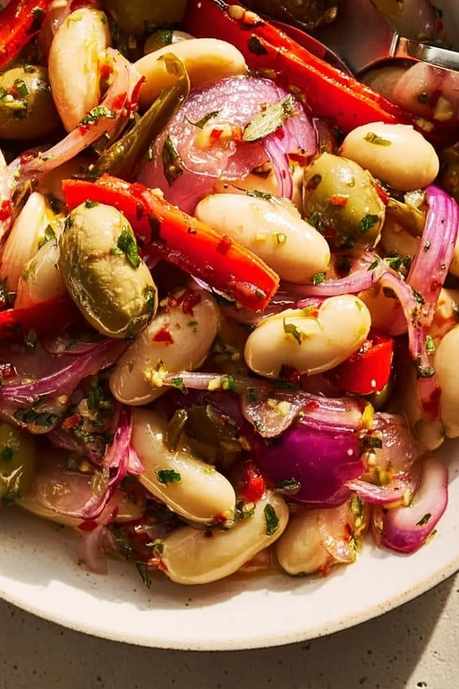Plate of marinated butter beans seasoned with herbs and spices