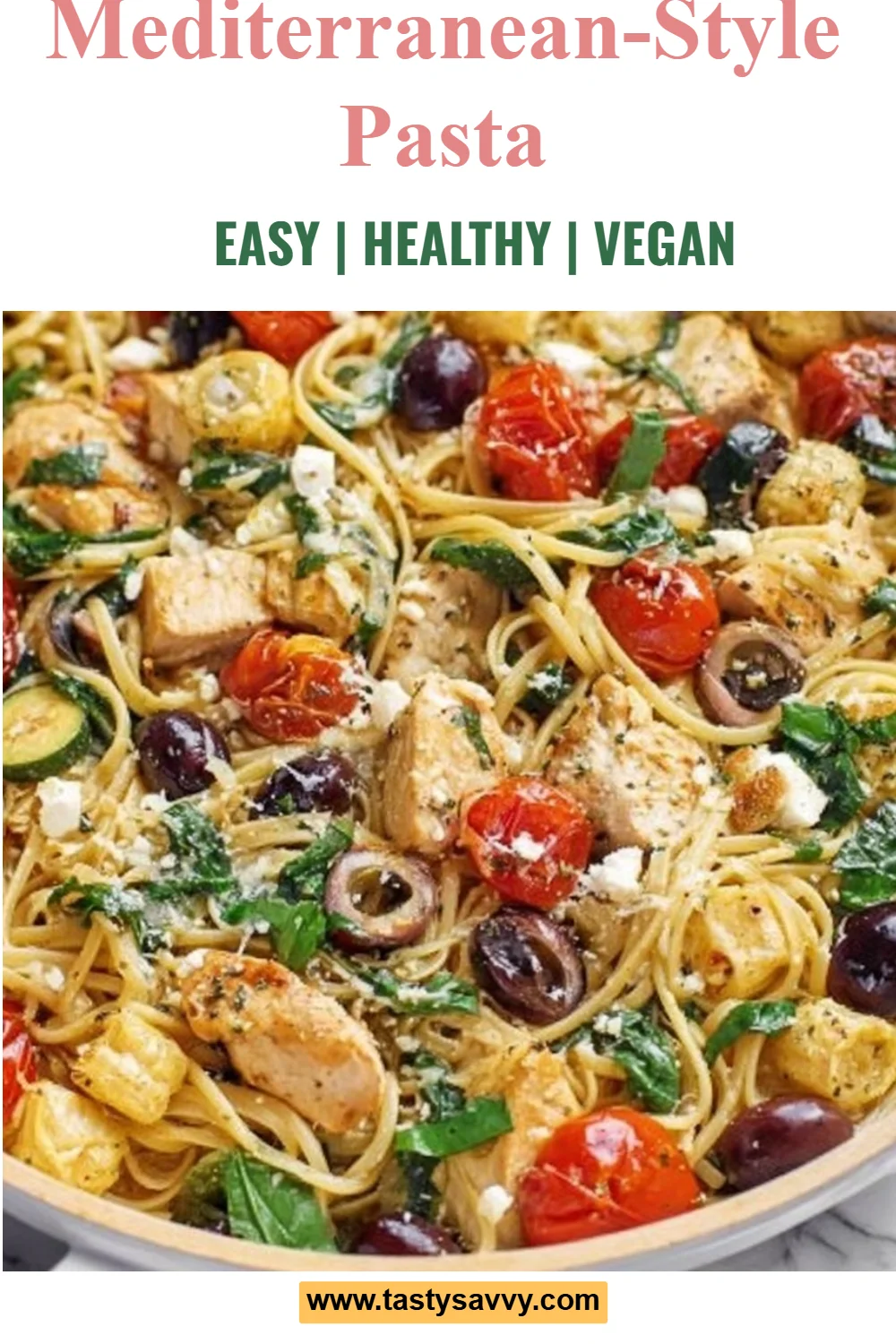 Bowl of Mediterranean-style pasta with fresh vegetables and herbs