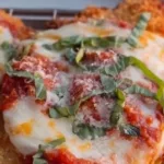 30 Minute Chicken Parmesan dish served on a plate with marinara sauce and cheese