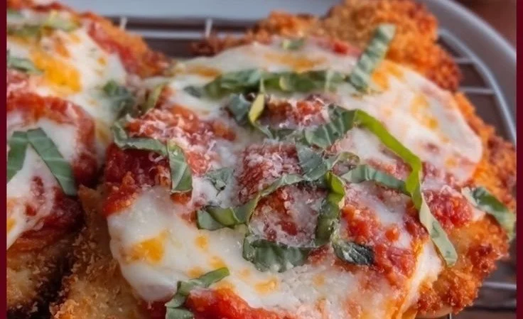 30 Minute Chicken Parmesan dish served on a plate with marinara sauce and cheese
