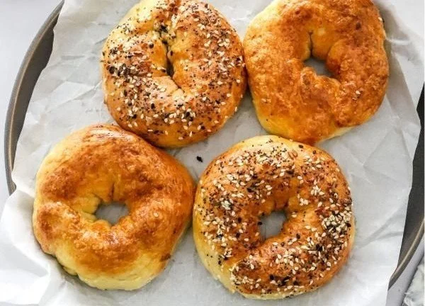 Air Fryer Protein Bagels topped with seeds and served on a plate