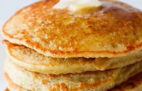 Delicious healthy oatmeal apple pancakes topped with fresh apple slices