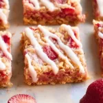 Healthy strawberry oatmeal breakfast bars baked with fresh strawberries and oats
