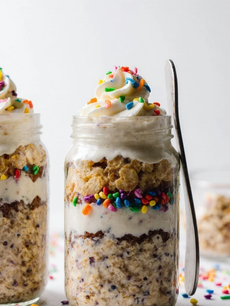 Colorful Birthday Cake Overnight Oats in a glass jar with sprinkles