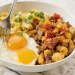 Delicious breakfast burrito bowl with eggs, veggies, and salsa
