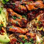 Delicious plate of Hawaiian BBQ Chicken garnished with tropical fruits