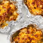 Delicious cheesy chicken foil packets ready for grilling.