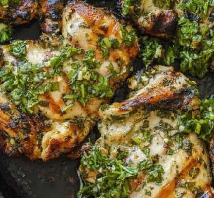 Chimichurri Chicken chimichurri chicken Grilled chimichurri chicken served with fresh herbs and vibrant sauce