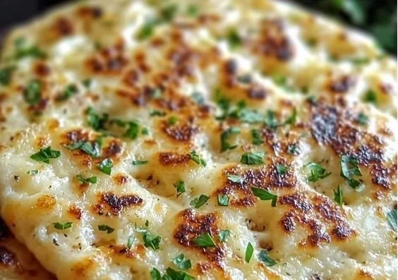 Homemade cottage cheese flatbread on a rustic wooden table