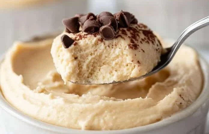 Cottage Cheese Peanut Butter Mousse cottage cheese mousse Creamy cottage cheese peanut butter mousse in a bowl, topped with nuts.