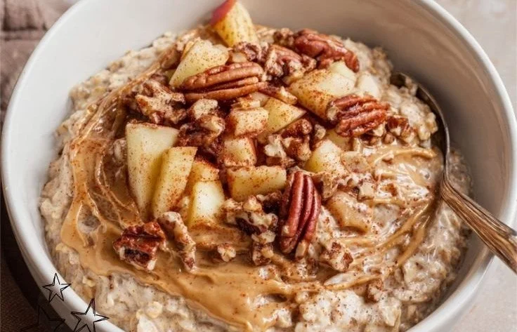 High Protein Apple Cinnamon Oats apple cinnamon oats Bowl of high protein apple cinnamon oats topped with fresh apples and nuts