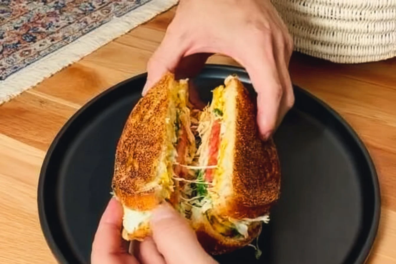 Low-calorie high-protein breakfast sandwich stacked with fresh ingredients