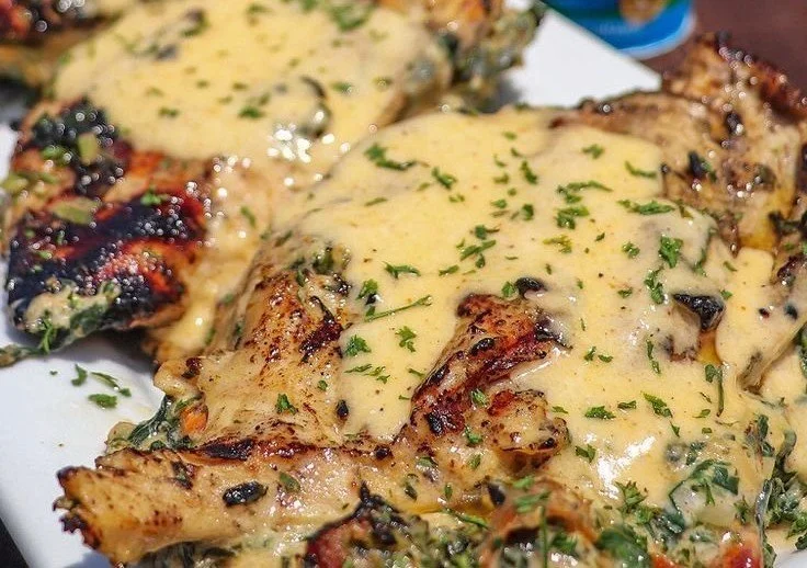 Delicious stuffed chicken ready to serve, showcasing a mouthwatering filling.