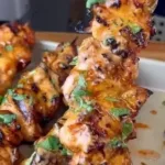 Delicious Bang Bang Chicken Skewers served on a platter