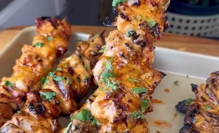 Delicious Bang Bang Chicken Skewers served on a platter