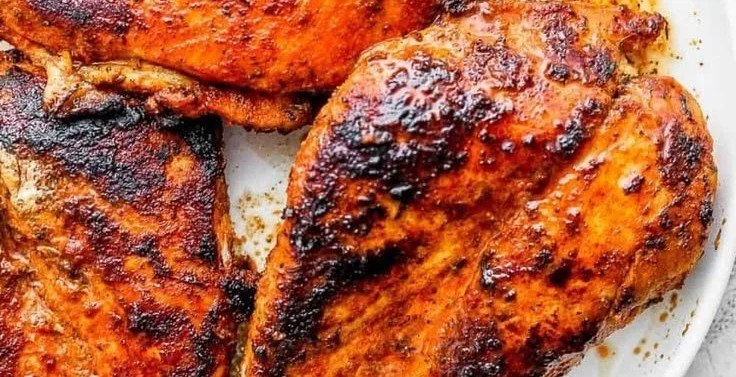 Blackened Chicken blackened chicken Deliciously seasoned blackened chicken on a plate with garnishes