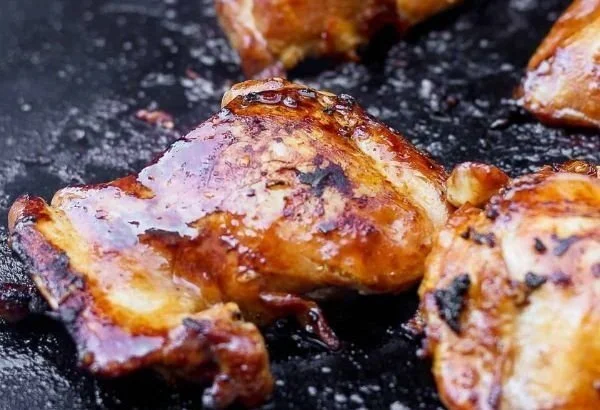 Blackstone Chicken Thighs chicken thighs Grilled Blackstone chicken thighs seasoned and cooked to perfection