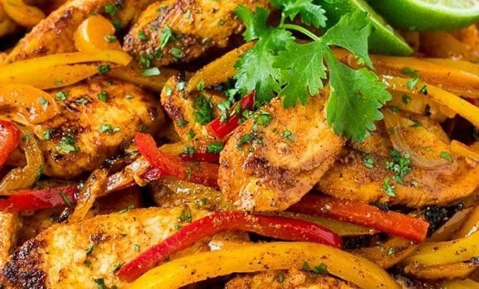 Chicken Fajita Marinade Chicken Fajita Marinated chicken fajitas with vibrant peppers and onions on a plate