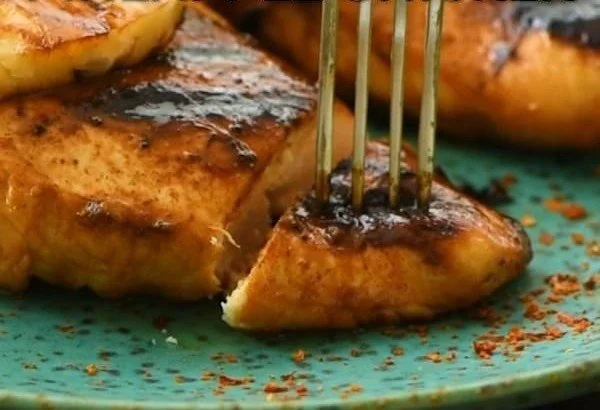 Grilled Chicken with Pineapple grilled chicken Grilled chicken with pineapple on a plate, garnished with fresh herbs.